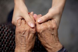 a pair of hands clasping each other